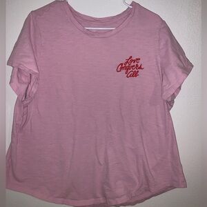 “Love Conquers All” Embroidered Tee